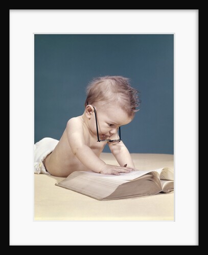 1960s Funny Baby Wearing Oversized Glasses Reading Big Book by Anonymous