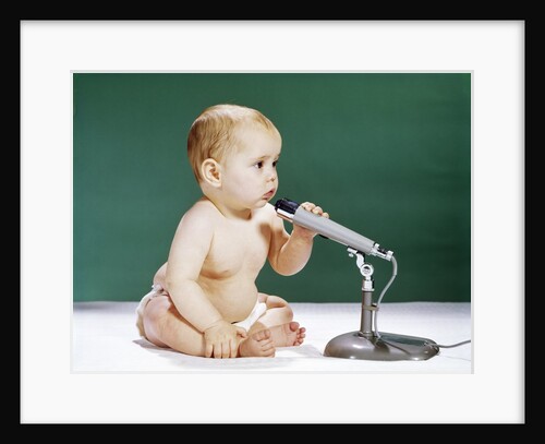 1960s Baby Holding And Talking Into Microphone by Anonymous