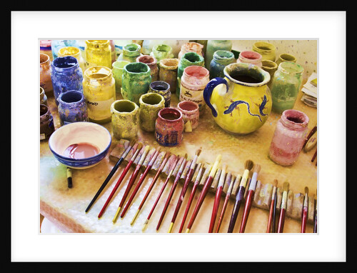 Paint brushes and colored paints by Anonymous