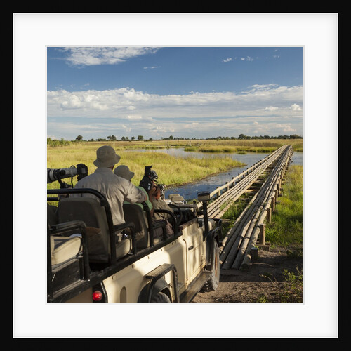 Safari Vehicle Crossing Bridge by Anonymous