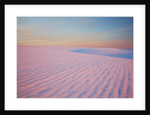 Sunset and patterns in snow covered wheat fields by Anonymous