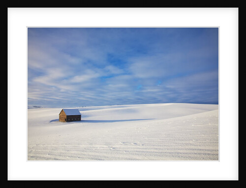 Small barn in snow covered field by Anonymous