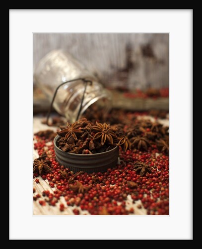 Star anise and red pepper corns around a rustic mason jar by Anonymous