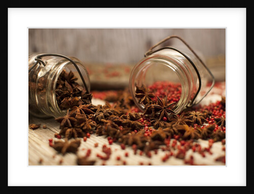 Star anise and red pepper corns around a rustic mason jar by Anonymous