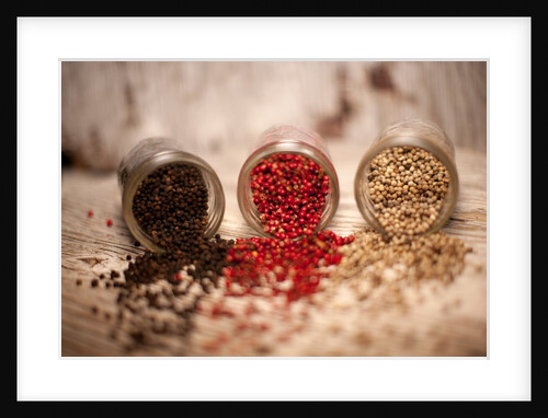 Black, red, and white pepper corns in rustic mason jars by Anonymous