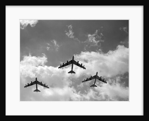 1950s three B-52 bomber airplanes in flight formation by Anonymous