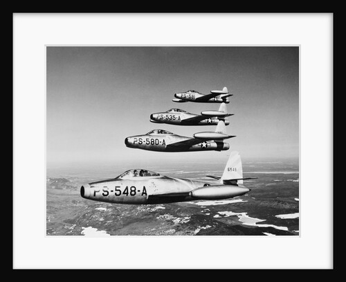 1950s four US air force F-84 thunder jet fighter bomber airplanes in flight by Anonymous
