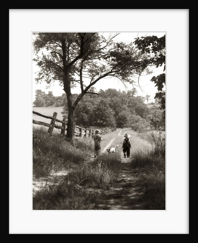 1930s boy and girl in straw hats walking down farm road by Anonymous