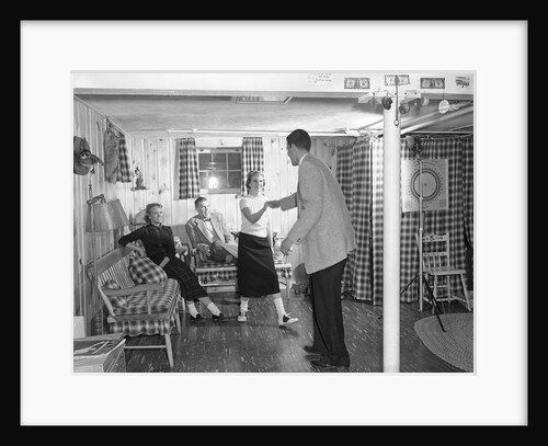 1950s teens in rec room dancing by Anonymous
