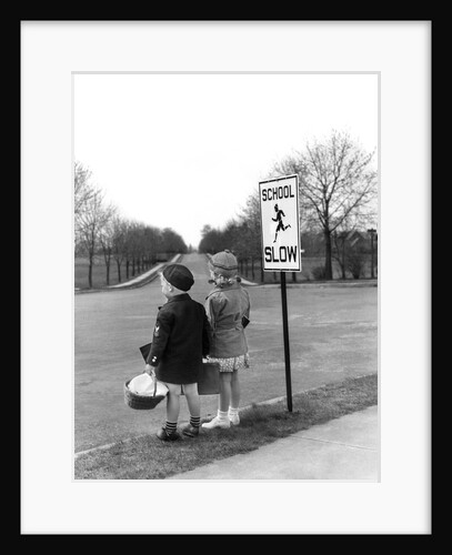 1930s 1940s boy and girl waiting to cross the road by Anonymous