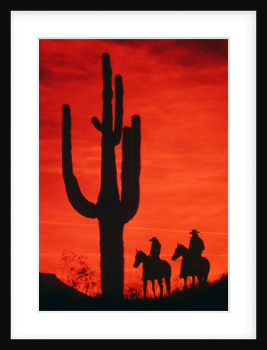 1980s silhouette of two anonymous cowboys riding on horseback by Anonymous
