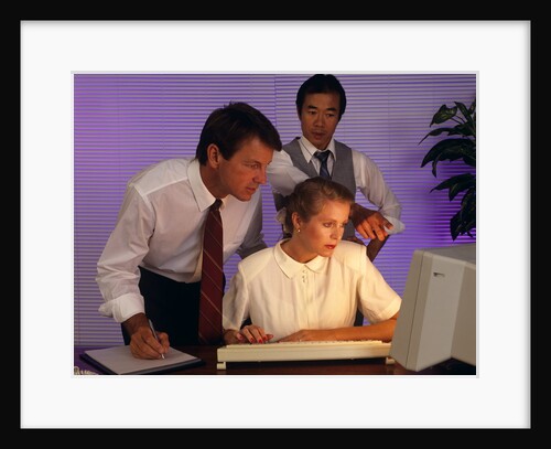 Business people working together at desktop computer by Anonymous