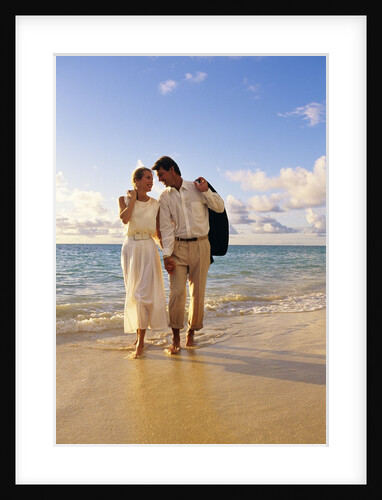 1980s 1990s couple walking on beach by Anonymous