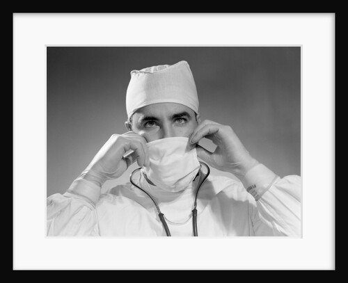 1960s male doctor wearing surgical mask and operating room scrubs by Anonymous