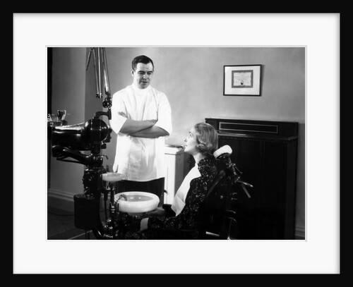 1930s 1940s dentist speaking with a female patient by Anonymous