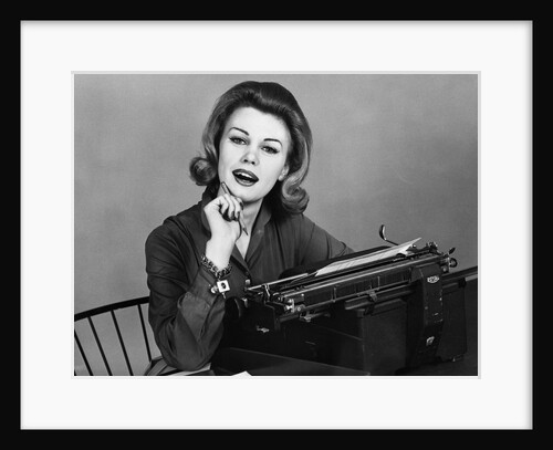 1960s smiling secretary with a typewriter by Anonymous