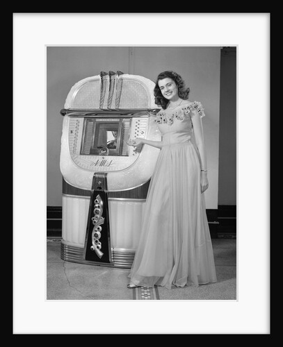 1940s smiling woman with a jukebox by Anonymous