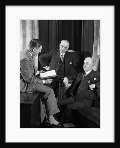 1930s businessmen having a discussion by Anonymous