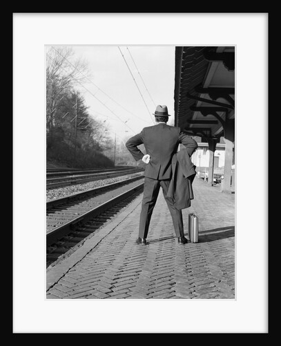 1950s 1960s man waiting for a train by Anonymous