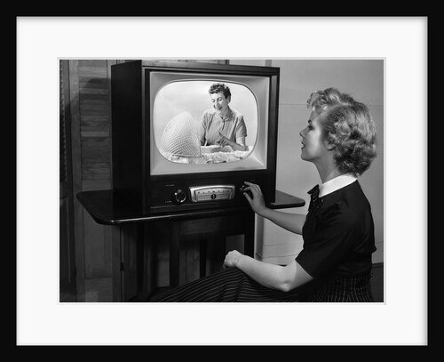 1950s woman watching tv program about child care by Anonymous