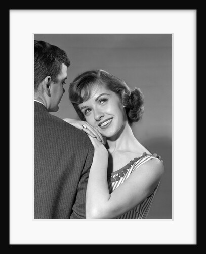 1950s woman resting on man's shoulder by Anonymous