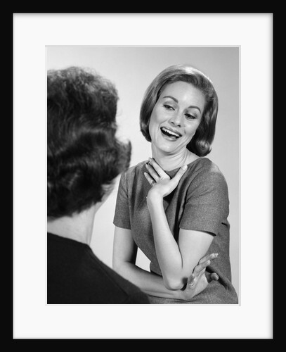 1960s two women talking by Anonymous