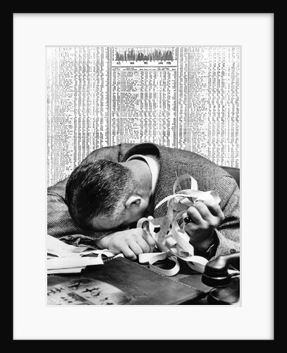 1930s man with head on his desk holding stock ticker tape by Anonymous