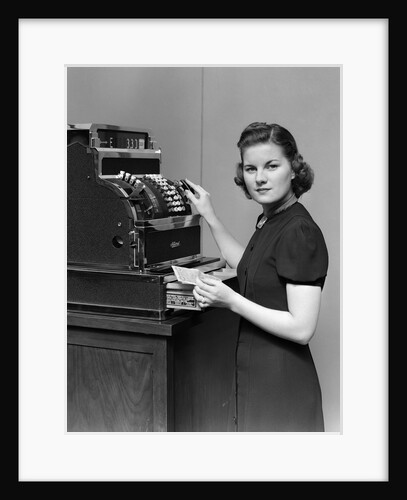 1930s 1940s portrait of female sales clerk at a cash register by Anonymous
