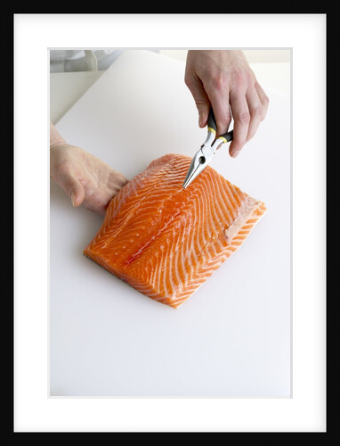 Deboning a salmon fillet by Anonymous