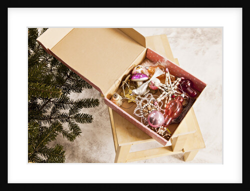 Box with Chistmas ornaments next to Christmas tree, Munich, Bavaria, Germany by Anonymous