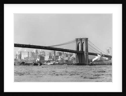 The Brooklyn Bridge spans the East River, ca. 1910. by Anonymous
