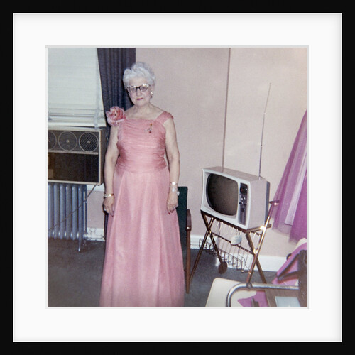 Grandma is all dressed up and standing next to a TV, ca. 1965 by Anonymous