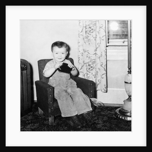 Young boy in his living room, ca. 1946. by Anonymous
