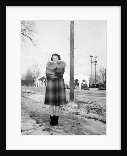 Young woman poses on street in Illinois, ca. 1940. by Anonymous
