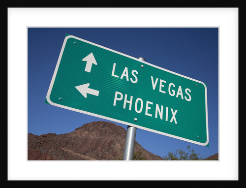 Road sign points to Las Vegas and Phoenix by Anonymous