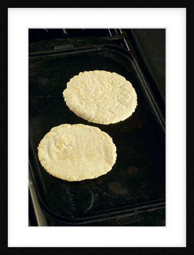 Cooking corn tortillas by Anonymous