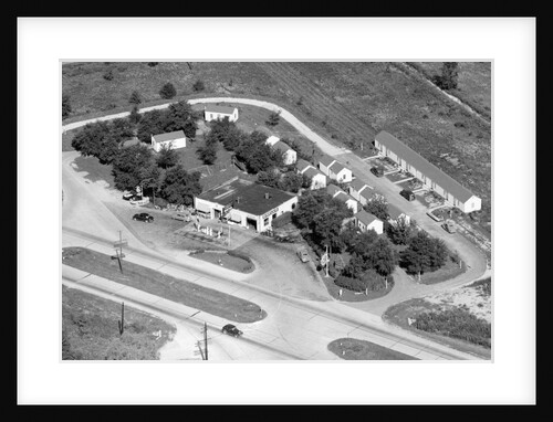 Aerial view of roadside motel and gas station in Indiana, ca. 1950. by Anonymous