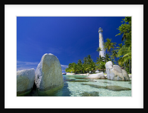 Beautiful view of an island with white lighthouse fringed by crystal clear sea and white granite boulders by Anonymous
