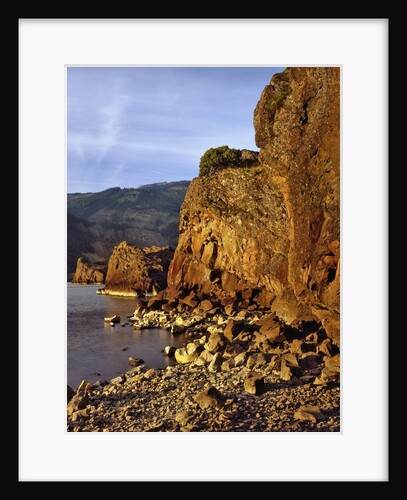 Evening light on basalt cliffs by Anonymous
