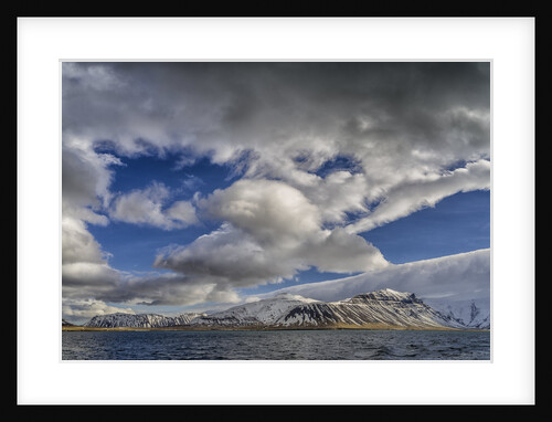 Clouds over fjord in the winter. by Anonymous