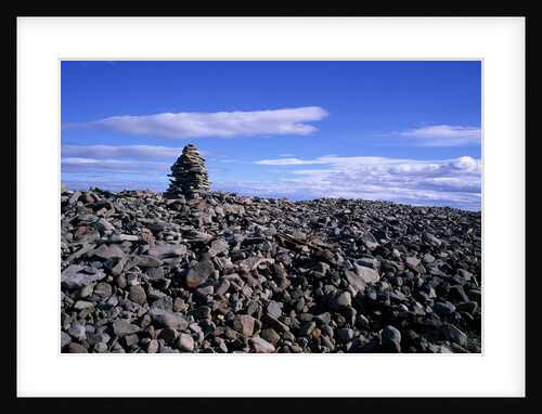 Stacked rock sculpture among rocky coastline. by Anonymous