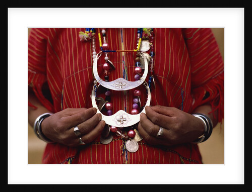 Woman holding tribal jewelry, Chiang Rai, Thailand by Anonymous