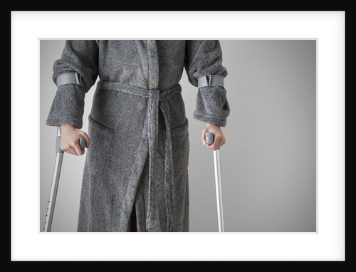 Figure on crutches by Anonymous