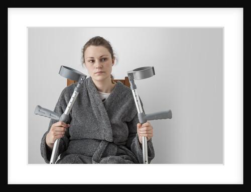 Woman seated with crutches by Anonymous