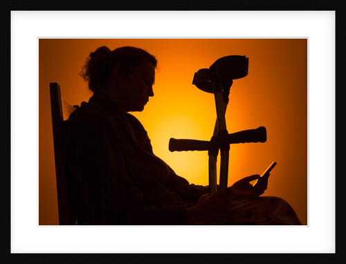 Woman seated with crutches by Anonymous