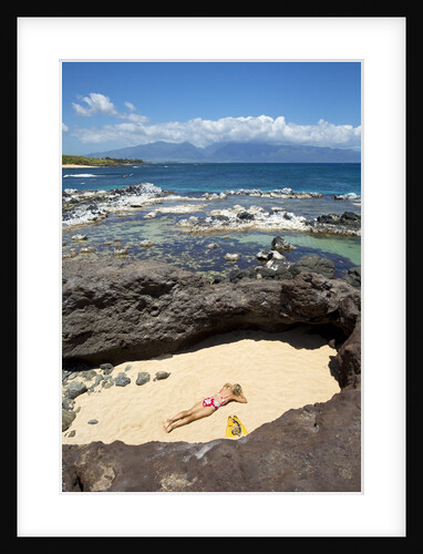 Woman sunbathing in secluded area of sand, Ho'okipa Beach Park, Maui, Hawaii MR by Anonymous