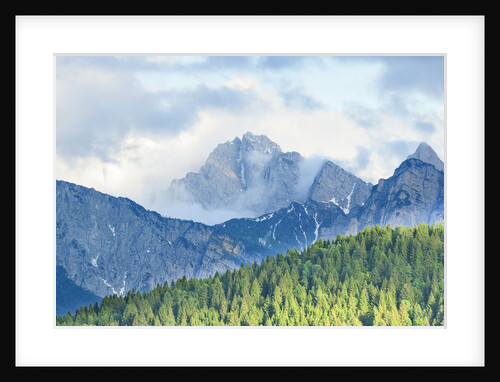 The mount Sernio emerges from the clouds and stands with majesty abiove the green woods, Alpi Carnic by Anonymous