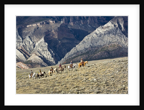 Cowboys and Cowgirls riding along the hills of the Big Horn Mountains by Anonymous