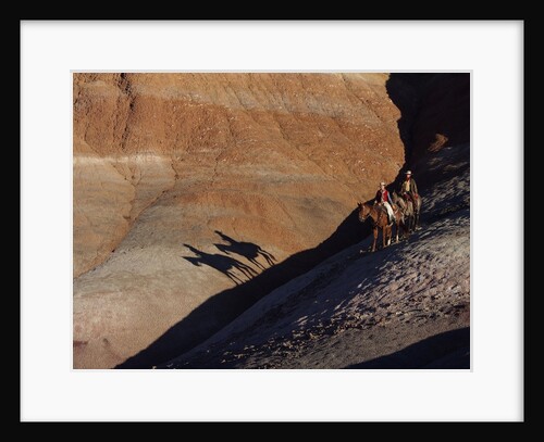 Riders with Shadow coming down Hill in Painted Desert by Anonymous