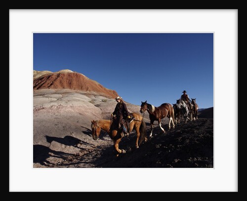 Riders and Horses with Shadows coming down Hill in Painted Desert by Anonymous